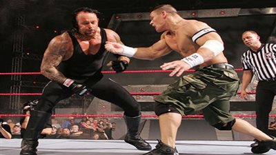 من أرشيف يوتيوب..أندر تيكر وباتيستا vs جون سينا وشون مايكلز