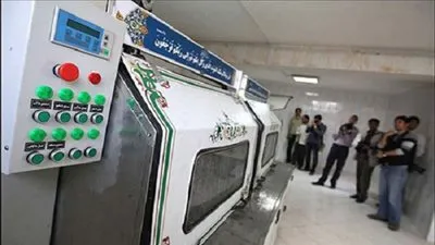 جهاز أتوماتيكي جديد لغسل الأموات بإيران يثير الجدل (صور)