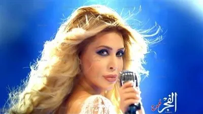 نيكول سابا تنشر صور من كواليس حلقتها مع عمرو أديب