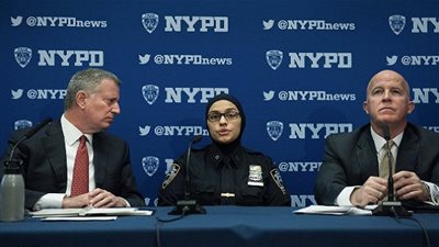 رجل أميركي يهدد شرطية مسلمة بذبحها!