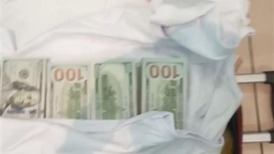 ضبط 50 ألف دولار بحوزة راكب بمطار القاهرة الدولي 