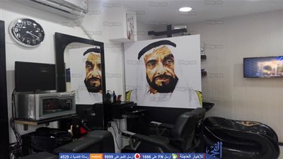وش الخير.. حكاية صاحب صالون حلاقة يزين واجهة محله بصورة الشيخ زايد