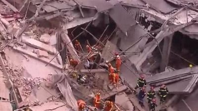 9 أشخاص محتجزون في انهيار مبنى وسط شنغهاي
