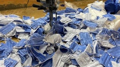 داخل مخزن بالعمرانية.. العثور على 15 ألف كمامة و20 لتر كحول