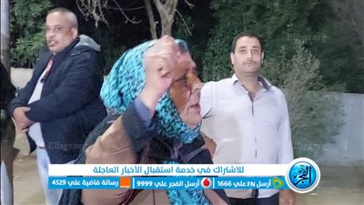 مسنة ترقص على أنغام الأغاني الوطنية أمام مدرسة محمود عمر بمحافظة الجيزة
