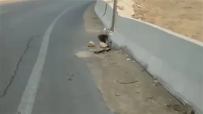 كشف ملابسات وجود هبوط أرضى بطبقة الأسفلت الملاصق لسور أحد الكبارى بطريق السويس بالقاهرة